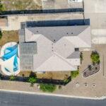 Aerial view of the home on a large corner lot.