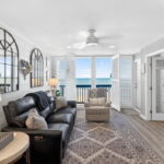 Living area, plantation shutters - French glass doors into the primary bedroom.