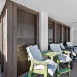 Outdoor from the living and primary bedroom is this balcony overlooking the pool, beach & Gulf waters.