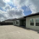 Concrete back yard. No need to water or mow.