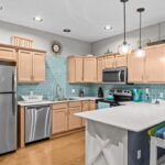 Stainless Steel appliances and Coastal Decor add the "At The Beach" feel of this cute unit.