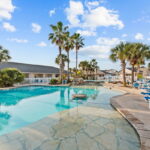 Large, sparkling pool and deck.
