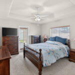 Bedroom #1 - with door leading out to 1 of 3 covered patios.