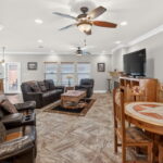 Entry into the Guest Quarters - living, fireplace, and doors out to 3rd covered patio and pool area.