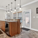 Kitchenette with door out to saltwater pool.