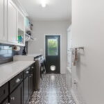 Expansive laundry room - with a designated pet-shower area. Lots of storage.
