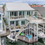 MULTI-level decking, 2-boat lifts and plenty of room for entertaining day or night!