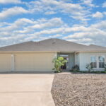 Three car garage and large driveway!