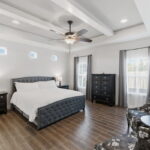 SPACIOUS primary bedroom. Comfortable and stylish.