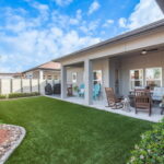 Backyard Astroturf landscaping, outdoor ceiling fans, fully fenced yard - how EASY is this to maintain!