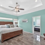 Gorgeous primary suite with a tray ceiling.