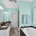 Primary bathroom, double sinks, walk-in shower and jet tub.