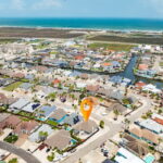 See the coast - this home is approximately 5-minutes drive or golf cart ride to the Whitecap Beach and the Bob Hall Pier.
