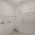 Hall laundry room - central to the bedrooms.