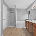 Primary Bathroom with dual sinks, garden tub, separate shower and TWO-separate closets.