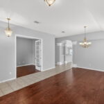 Looking towards the 4th bedroom or office/media room with French glass doors.