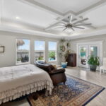 Beautiful Tray Ceiling - Double doors to covered patio and pool.