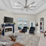 Wood Burning Fireplace - Patio and pool views from the over-sized windows.