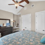 Second bedroom features two closets and a built-in desk space.