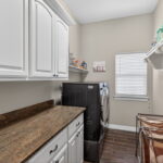 Spacious utility room with extra storage.