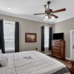 Primary bedroom offers patio access.