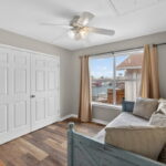 Room with trundle bed next to Primary
