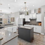 Gas cooktop with stainless Vent-A-Hood.