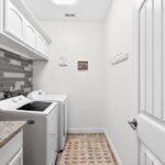 Large laundry room with plenty of storage.