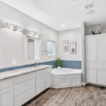 Owner's luxury bath - his & her vanities, jetted soaker tub with plenty of cabinets and drawers.