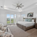 THIRD FLOOR - 2nd Primary Bedroom with doors out to a private balcony with water views