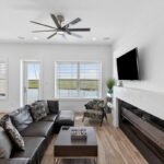 SECOND FLOOR - Living area with door out to the covered decking and water views!!