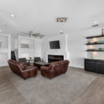 THIRD FLOOR - Bunk areas, fireplace, wet bar and door out to the covered deck patio area.