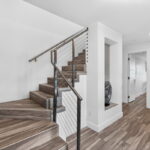 First floor entry with staircase OR elevator to upper floors.