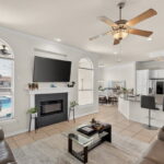 Living, kitchen, dining are open out towards the pool area.