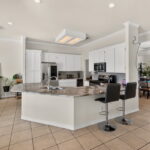 Kitchen with granite counters and stainless appliances.