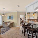 Dining or sitting area. Kitchen breakfast bar.