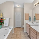 Primary bath - double sinks & a jet tub.