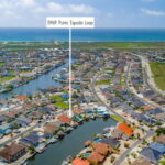 Aerial view - Approximately a 5 minute golf cart ride to the Whitecap Beach.