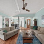 Entry door with view of living, kitchen, and sunroom.