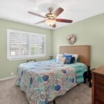 BEDROOM #1 - soft carpeting, plantation shutters, and walk-in closet space.