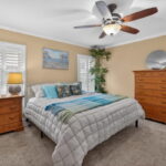 PRIMARY BEDROOM - spacious & comfy! Plantation shutters.