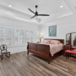 Spacious primary bedroom with built-in cabinet