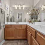 Dual sinks and vanity - next to the large walk-in closet